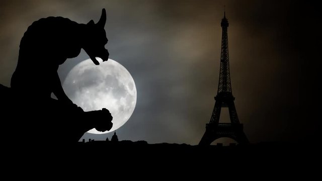 Paris: Gargoyle or chimera on the Gothic Cathedral of Notre Dame looks at the Eiffel Tower and city Skyline by Night with Full Moon, France. Gargoyles are old demon statue in French Culture