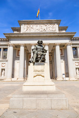 Fototapeta na wymiar Madrid, Spain. Statue of Velasquez (1899) on the background of the facade of the Prado Museum
