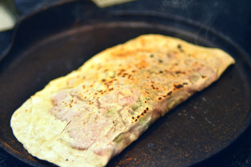 products of thin dough, baked with meat in a pan , oriental cuisine, traditional food, restaurant