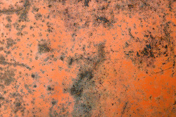 old rusty iron sheet covered with faded red paint