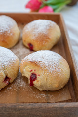 German donuts - krapfen or berliner - filled with jam