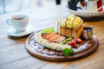Vanilla toast with berry fruit with coffee as background
