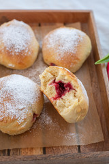 German donuts - krapfen or berliner - filled with jam