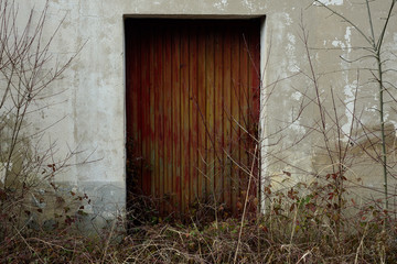 old and chipped garage door in the town of Monasterioguren, Alava (Basque Country)