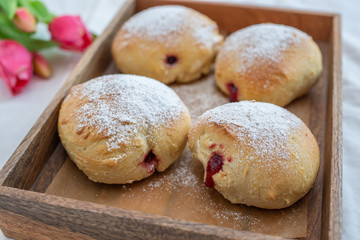 German donuts - krapfen or berliner - filled with jam