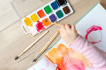 Kids paint with watercolors