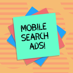 Word writing text Mobile Search Ads. Business concept for ad that can appear on webpages and apps viewed on phone Multiple Layer of Blank Sheets Color Paper Cardboard photo with Shadow