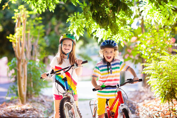 Kids on bike. Children on bicycle. Child biking.