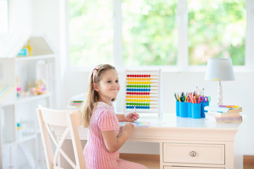 Child drawing. Kids paint. Girl after school.