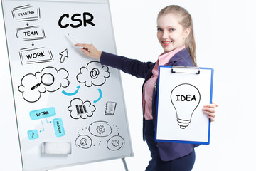 Business, technology, internet and networking concept. Young entrepreneur showing keyword: CSR