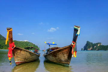 Longtail boats anchored at Ao Loh Dalum beach on Phi Phi Don Island, Krabi Province, Thailand