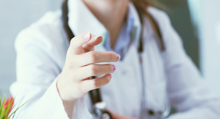 Closeup female health care professional, woman doctor pointing finger, you did something wrong. - obrazy, fototapety, plakaty
