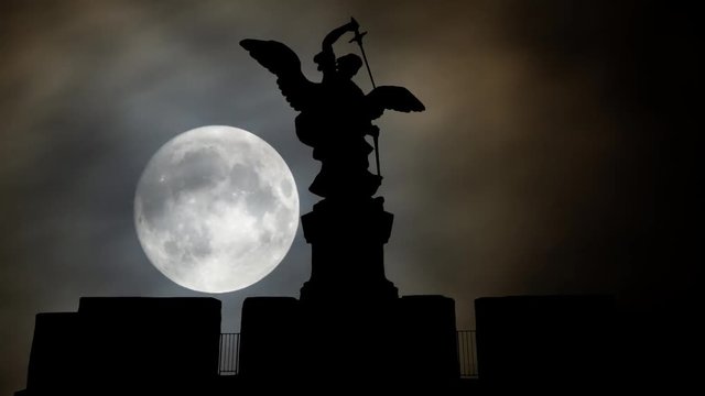 Rome: Bronze statue of Michael the Archangel in Silhouette by Night with Full Moon, standing on top of the Castel Sant'Angelo or Castle of the Holy Angel (Mausoleum of Hadrian), Italy, Europe