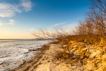 Sandy beach in the Hel Peninsula. Cold winter evening in Jastarnia. Poland.