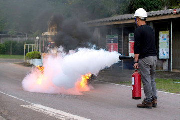 Firefighters use fire extinguishers. 