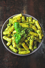 Delicious Italian pasta with pesto and basil.