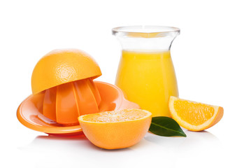 Fresh raw peeled oranges with juice squeezer jar