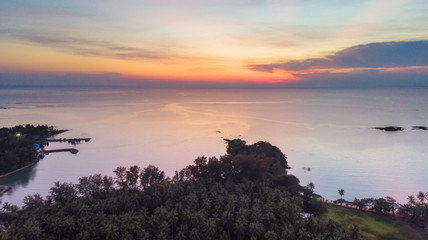 Evening time at patong bay city when the sun disappear with colorful twilight skyline and night light. After sunset at patong bay,high angle view.