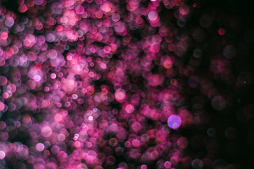 abstract bright colorful violet and red bokeh glitter sparkle blurred background. like molecule spread and absorb.