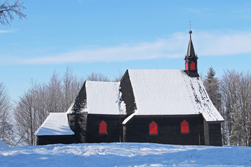 old wooden church on Prasiva hill, Beskydy, Czech Republic in winter