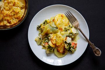 Fish pie with sliced potato topping
