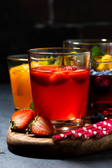 Fototapeta na wymiar fruit and berry beverages in assortment, vertical