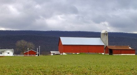 A color image of a red barn in Big Valley, Belleville, Pennsylvania. © Christine