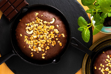 Food concept Homemade Brownies baked in iron cast skillet with copy space