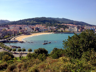 Fototapeta na wymiar Panorama of Castro Urdiales with sandy beach and blue Cantabrian sea water, Northern coast of Spain