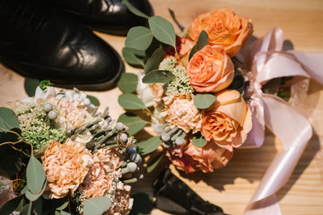 Grooms accessories for preparation on wedding day, shoes, rings and bouquet