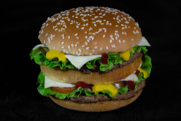 burger on a black wooden background