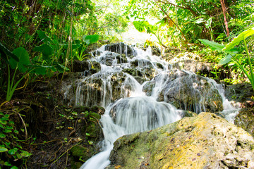 Close up on small waterfall in Xcaret Park, Mexico. Long exposure 