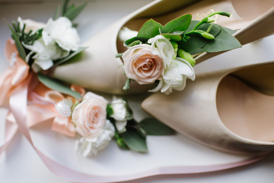 Brides accessories pretarations for wedding day, shoes and buttohole