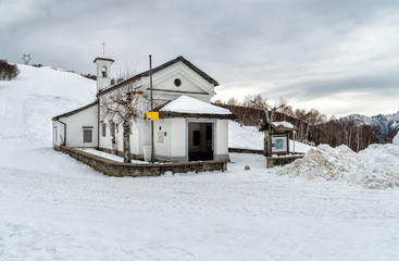 View of the Madonna of the snow Church in Forcora pass, Val Veddasca, province of Varese, Italy