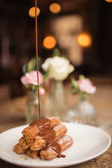 Cinnamon sugar dusted churros with chocolate sauce. Concept of food, dessert and baking. Traditional Mexican food.