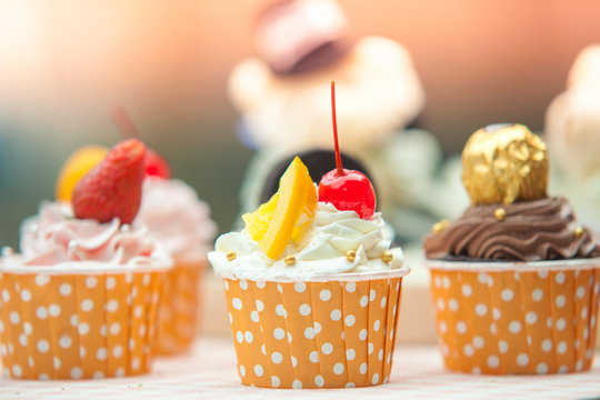 Set of cup cake cream with fruit dessert whip cream and strawberry orange in party. food drink concept image
