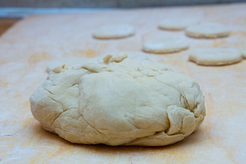 Grandmother cooks dumplings on kitchen