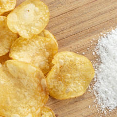 Delicious potato chips with salt