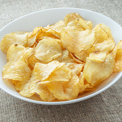 Delicious potato chips with salt