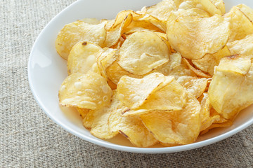 Delicious potato chips with salt