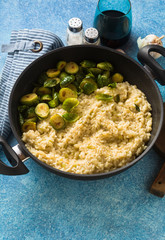 Italian spring risotto with Brussels sprouts and parmesan cheese on the table. healthy food for the whole family, party or restaurant menu