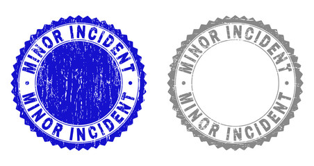 Grunge MINOR INCIDENT stamp seals isolated on a white background. Rosette seals with grunge texture in blue and grey colors. Vector rubber stamp imprint of MINOR INCIDENT tag inside round rosette.