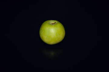 Green Apple on black background