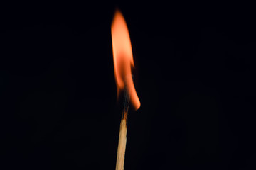 Match burning in the dark