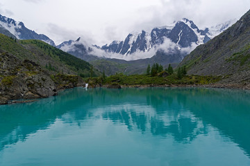 Fototapeta na wymiar Reflection of mountains in the water. Altai Mountains, Russia.