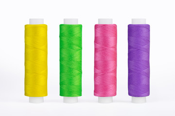 Set of sewing thread coils, miscellaneous colours, isolated on white