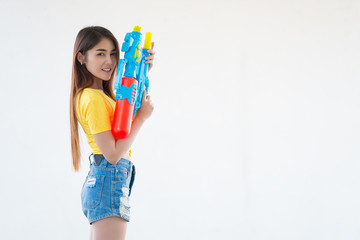 Asian sexy woman with water in hand on white background,Festival songkran day at thailand,The best of festival of thai,Land of  smile