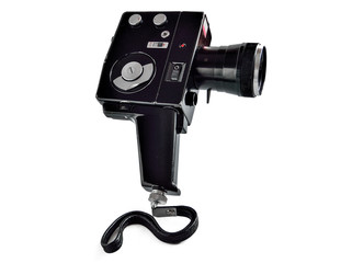 Vintage movie camera isolated on white background