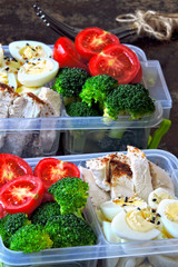 Lunch boxes with a healthy meal. Vegetables, quail eggs and chicken breast. Lunch boxes to go