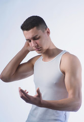 Beautiful young European athletic with dark hair in a white t-shirt